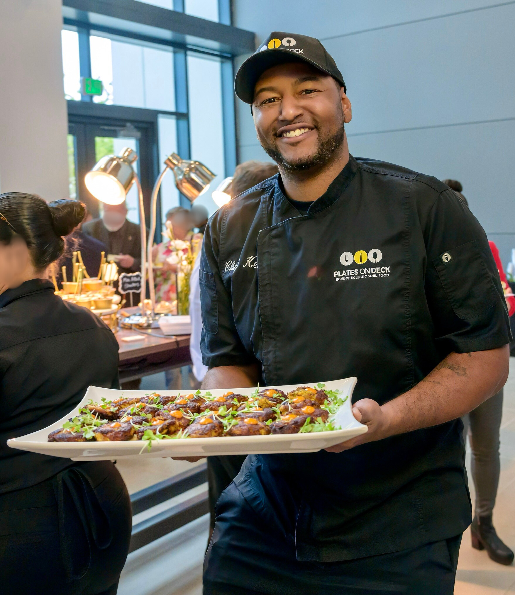 Chef Ken, owner and head chef of Plates On Deck, plating a dish