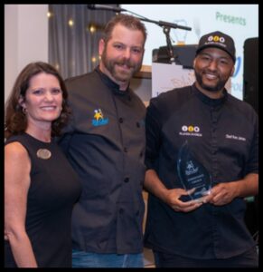 Chef Ken accepting Achievement Academy's Top Chef of Polk County 2026 Community Choice Award